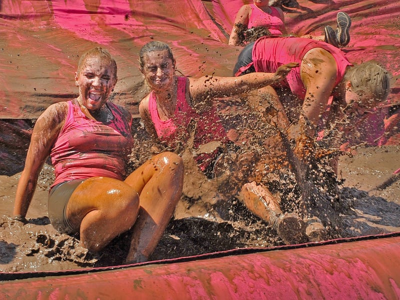 Molly Baldwin and Gabbi Ellis of Jane's Joggers getting muddy.