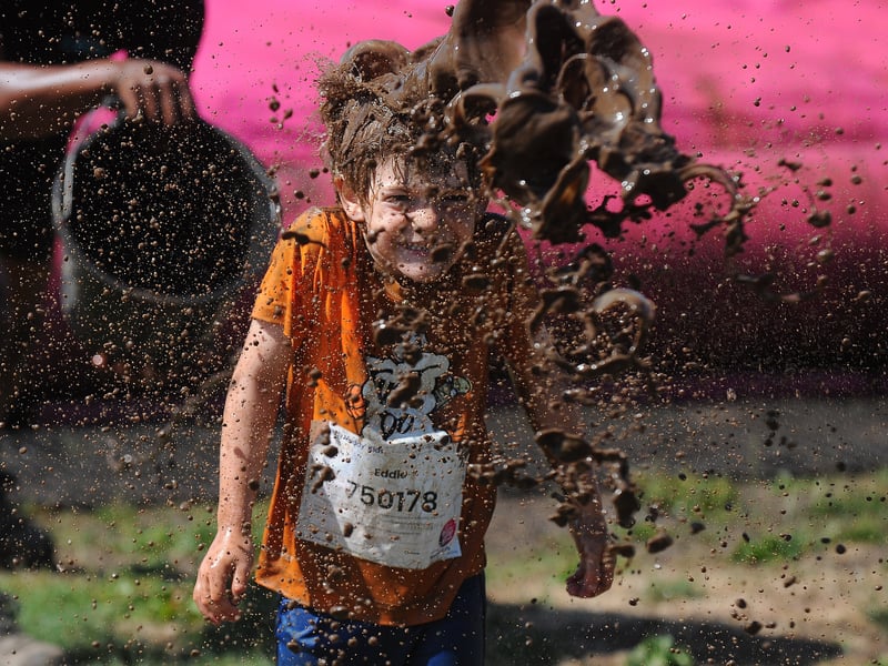 Eddie Park gets caught on the last obstacle before the finish   Pretty Muddy Kids Race.