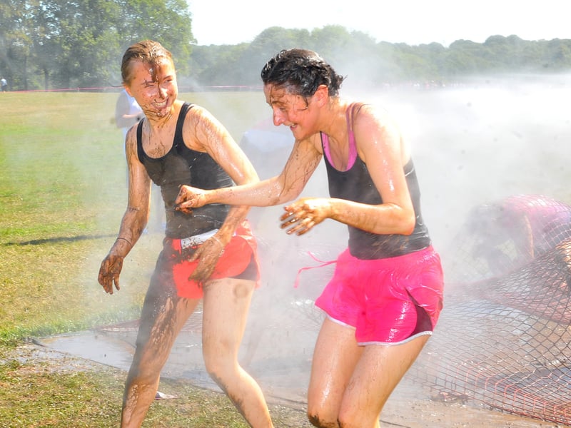 Runners taking on the Pretty Muddy race at Temple Newsam.