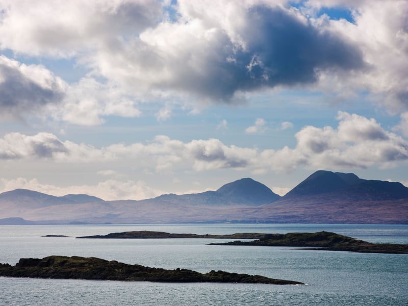 Rugged, remote and utterly captivating, Jura is a wild island where deer outnumber people by 30 to 1. It’s a land of dramatic coastlines, quiet lochs and the iconic Paps of Jura, three distinctive mountains that dominate the skyline. Visit the Jura Distillery in Craighouse, take a shoreline walk, or explore hidden beaches and caves. The island also offers incredible wildlife spotting, from golden eagles to seals and red deer. Don't miss the chance to sample Deer Island Scottish Spiced Rum and Lussa Gin, both crafted right here on Jura using local botanicals and a generous island spirit. Despite its untamed feel, Jura is wonderfully accessible for a summer break. 