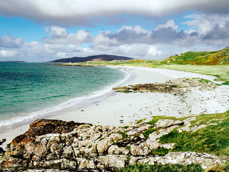 With a population of roughly 200 people, Eriskay enchants visitors with its white beaches and sparkling turquoise waters. Walk in the footsteps of Bonnie Prince Charlie, who first came here in 1745, or spot the island’s famous Eriskay ponies, a rare native breed. Walk through the main village and make sure to stop by its friendly pub, which was made famous by Whisky Galore and the sinking of the SS Politician and its precious cargo of whisky. Take time to explore, savour the tranquillity, and keep an eye out for otters and seals along the shore.