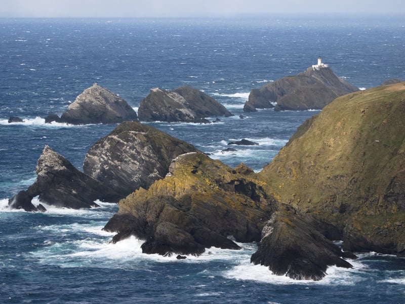 The UK’s most northerly island, Unst is a wild and wonderful place where impressive cliffs meet ancient Viking history and untouched natural beauty. Here, you can marvel at the jagged sea stacks of Muckle Flugga and the iconic lighthouse perched at Britain’s northern tip. Step back in time at the Unst Heritage Centre, which brings the island’s rich past to life, or experience Norse life for yourself inside a reconstructed Viking longhouse, complete with longship. Unst is a true paradise for wildlife lovers. At Hermaness National Nature Reserve, you’ll find spectacular colonies of gannets, puffins, and great skuas, while along the shore, you might spot playful otters. Don’t miss the sight of hardy Shetland ponies grazing peacefully in the fields. It’s one of Scotland’s best places for stargazing, with exceptionally dark skies and very little light pollution. Experience the awe-inspiring Sky Trail and take in glittering constellations and the Milky Way. The island is also leading the way in space tourism. At SaxaVord Spaceport, Unst is on track to host the UK’s first vertical rocket launch into orbit and a new visitor centre also opened this year. Unst’s community is full of character, too. Take a tour of the Shetland Distillery, learn to create beautiful glass items at Glansin Glass and enjoy the quirky Bobby's Bus Shelter!