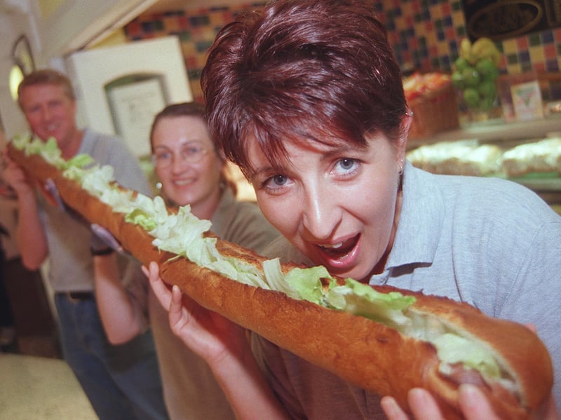 Janette French, Susan Henser and Vaughn Steel tuck into a six-foot long baguette at Deli Shuss in Orchard Square, Sheffield, in 1999