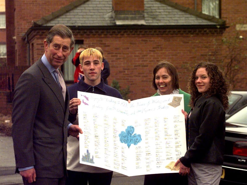 Prince Charles is presented with a huge birthday card from residents of Sheffield's Manor estate one day early, on November 13, 1998