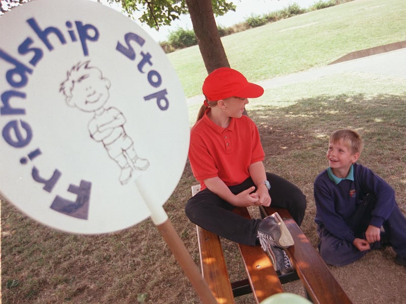A Ballifield Primary School 'Playground Friend' Jodie Harrison chats to Matthew Holmes during the afternoon break in