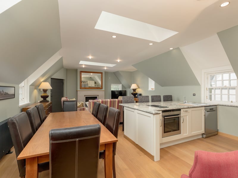 The accommodation comprises a living room with oak floor and gas fire which is open plan to a high spec kitchen with granite worktops.
