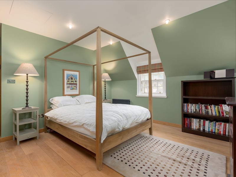 The guest flat also includes a family bathroom and bedroom. There are doors and outside stairs at both ends.  
