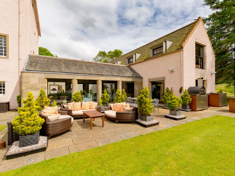 Couston Castle also features a paved patio which overlooks the loch. Connected to the dining room, it includes an outside kitchen/BBQ.
