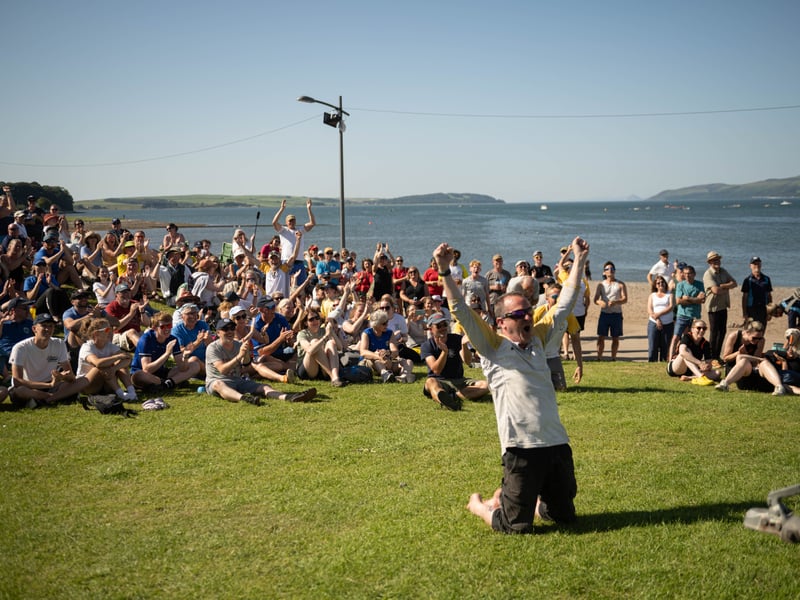 Supporters of the Edinburgh-based Eastern Amateur Coastal Rowing Club cheer on their rowers.