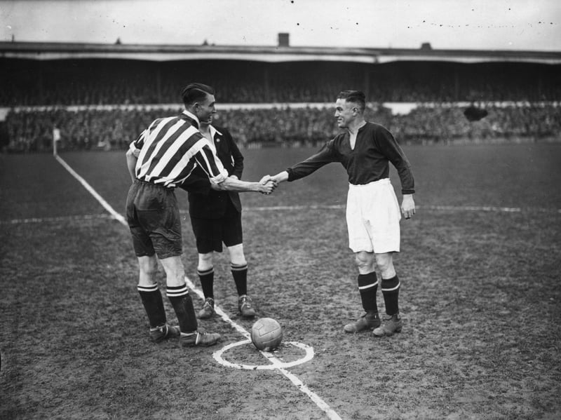 18th January 1934: The Southampton captain, Bradford, shakes hands with the Northampton Town captain, Crilly, before the FA Cup replay between the two sides kicks off at Northampton in January 1934