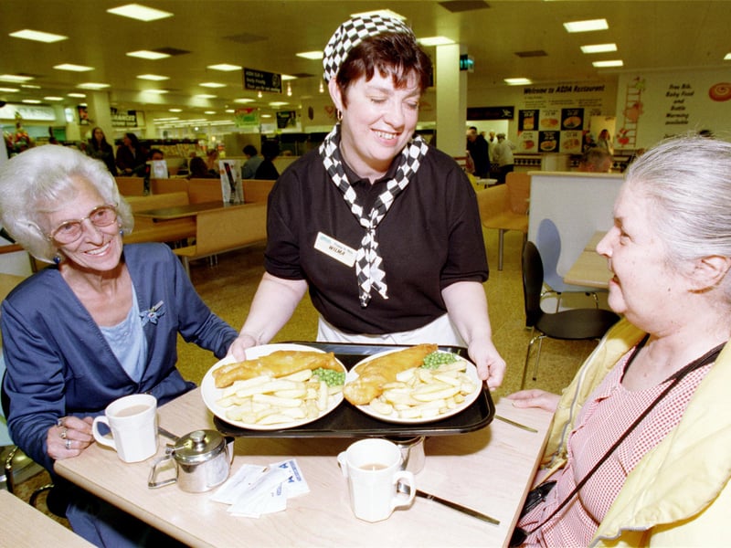 Wilma Wynn serves her 30,000th meal to regular customers Louise Turnbull and Alma Westwater at the Asda Jewel store in May 1999