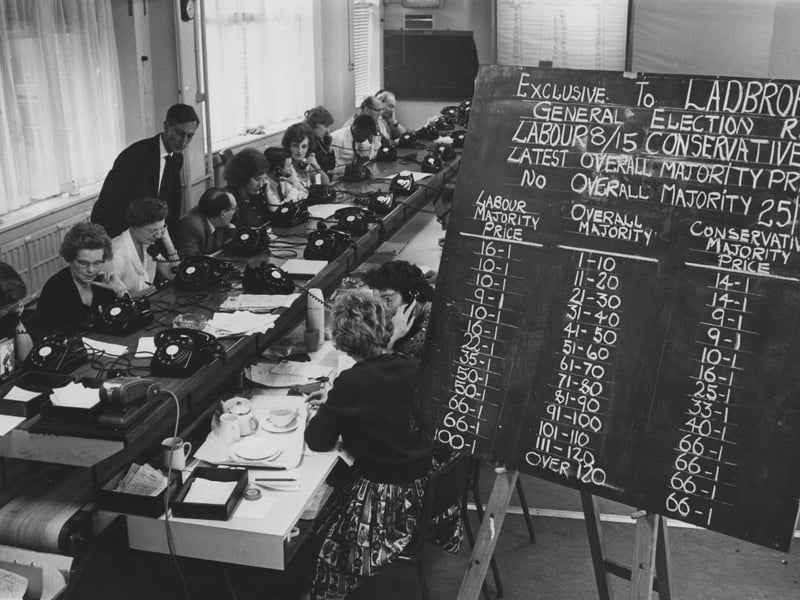 Staff at Ladbrokes bookmakers taking bets for the upcoming General Election in October 1964