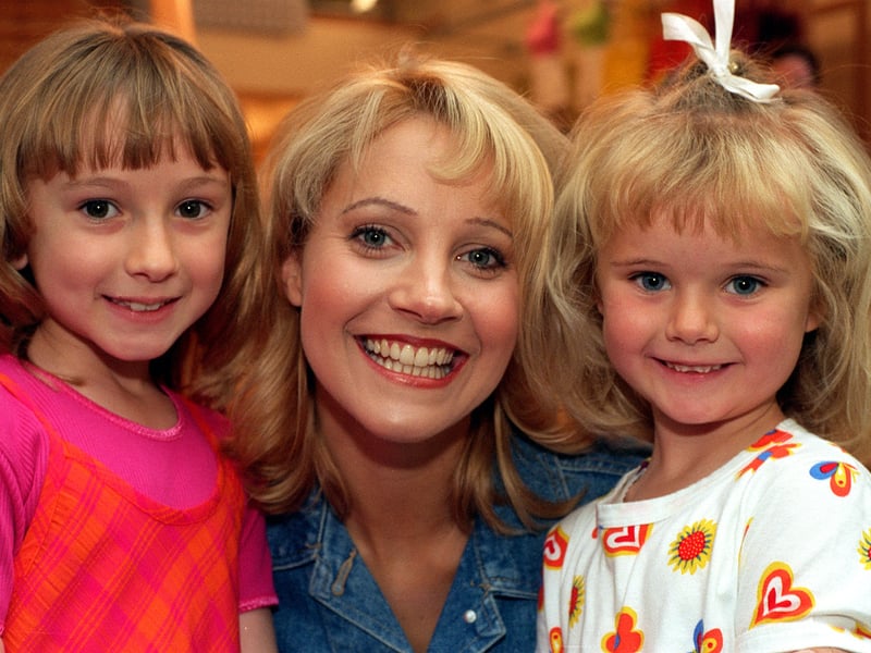 Sisters Jennie, 8, and Faye, 5, Cropley meets Emmerdale actress Malandra Burrows when she opened Etam in June 1997.