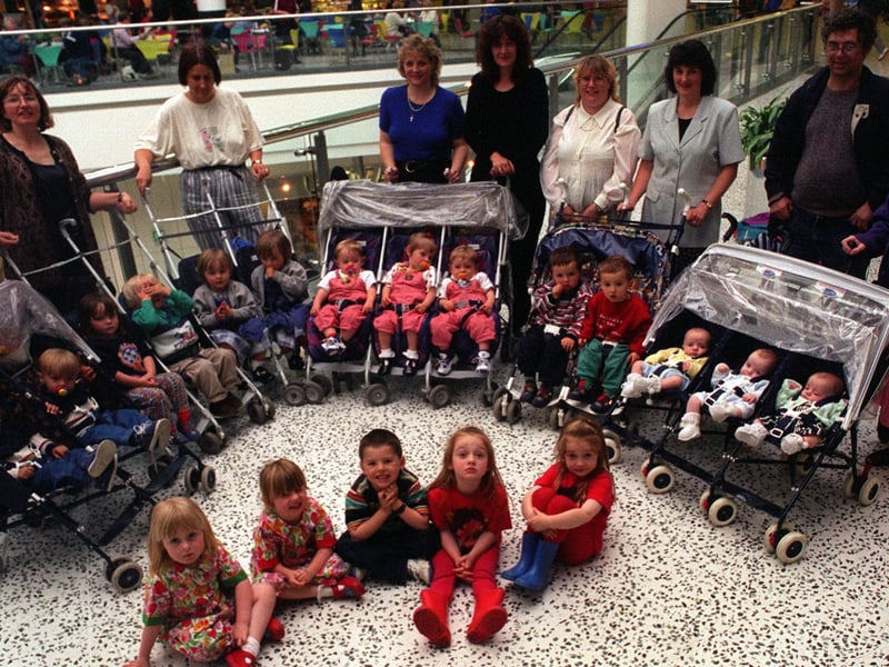 Twins and triplets club members with their parents.
