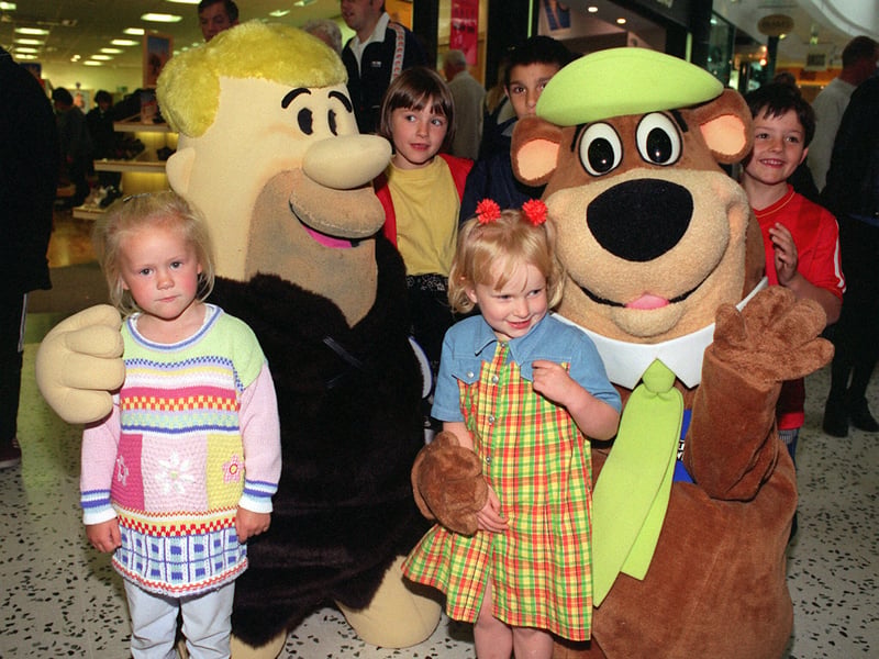 Yogi bear and Booboo were entertaining shoppers with their usual pranks and handing out goodies in June 1997.