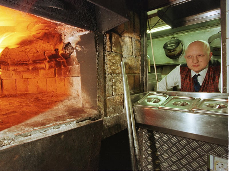 Vito Alongi at the Jolly Restaurant, Elm Row, Edinburgh, pictured next to his wood-burning pizza oven, in 1999