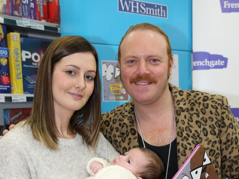 Leigh Francis, better known as Keith Lemon, pictured with Shannen Stoker and nine-week-old Mia Nicholson at a WHSmith store in Doncaster, South Yorkshire, in 2015