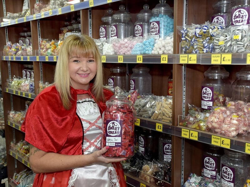 Shop assistant Lisa Bateson pictured with sweets at a WHSmith shop in Leigh in 2019