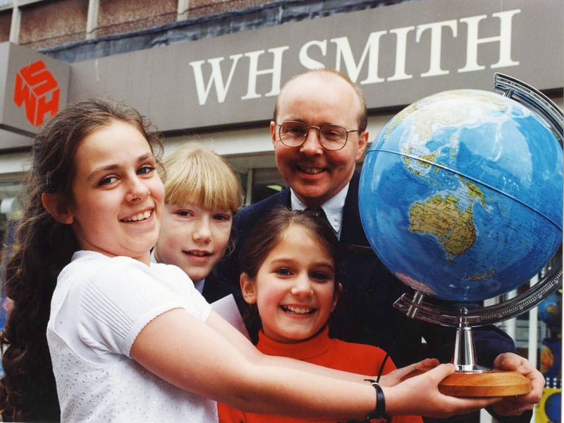 Winners of a Red Nose Day poetry competition organised by WHSmith collect their trophies in March 1995. Pictured with WHSmith manager Ian Hudspith are Rachel Smith, Michelle Shotton and Clare Alaige.