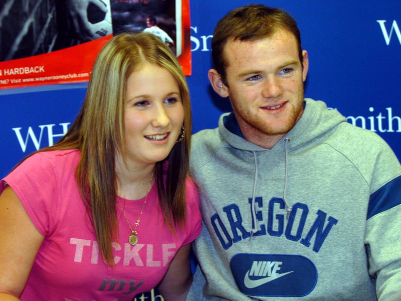 Wayne Rooney pictured with an admirer during a book signing in the WHSmith store at Meadowhall, South Yorkshire, in November 2006