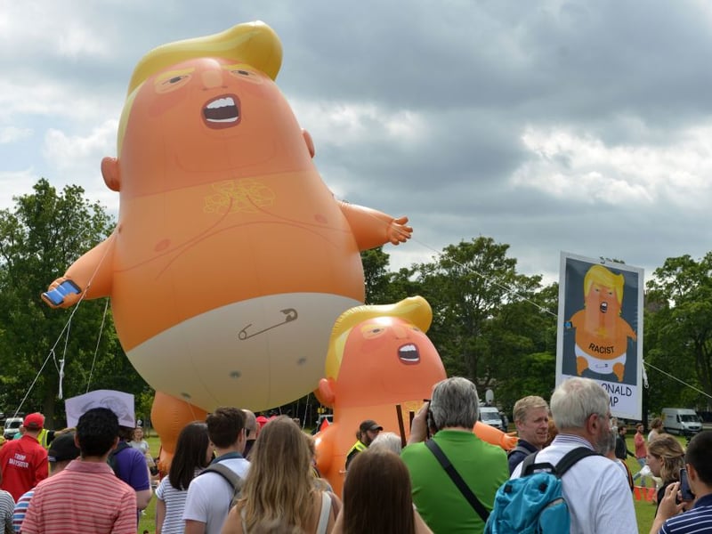 Giant balloons depicting US President Donald Trump as an orange baby were launched in the Meadows in Edinburgh.