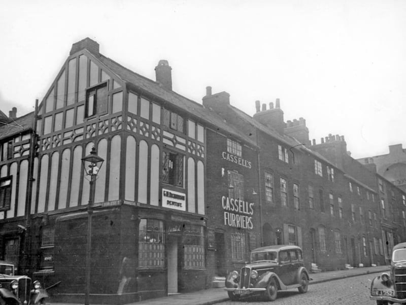 Burgess Street, Sheffield, at the corner of Cross Burgess Street, sometime during the 1920s or 30s. Pictured are T. W. Richardson, dentist surgery, and Cassells, furriers.