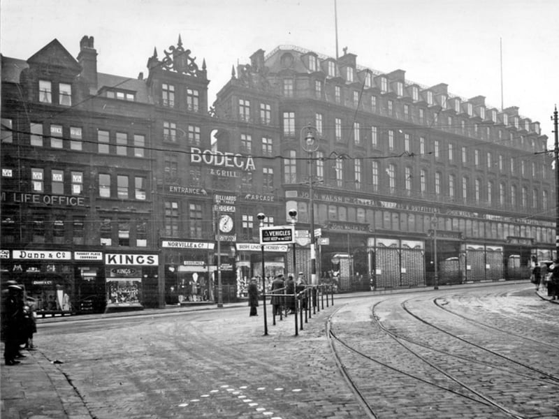 High Street, Sheffield, seen from Market Place, sometime between 1920 and 1939. The businesses pictured include John Walsh department store and Bodega wine and spirit merchants