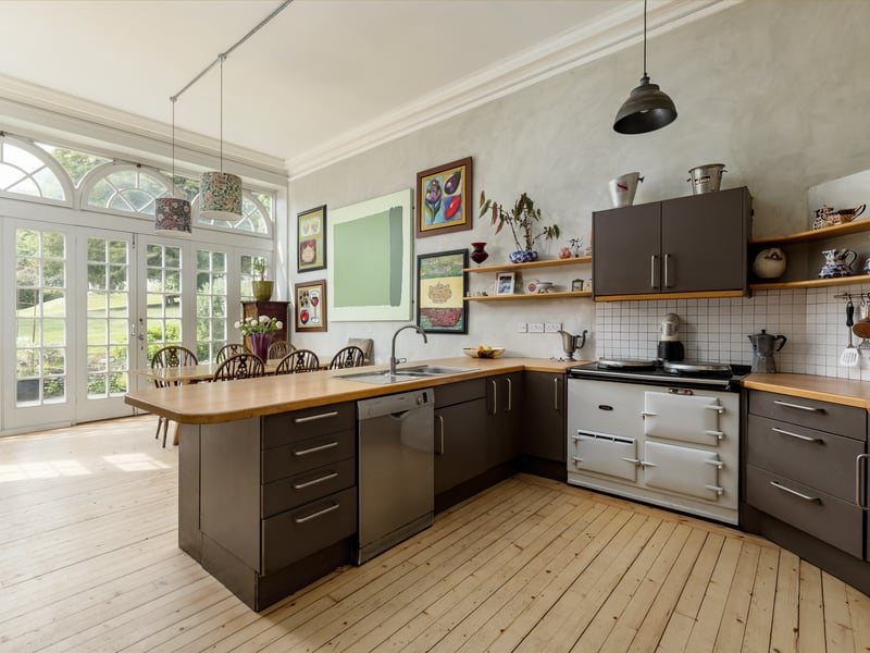 Positioned to the rear of the house is the kitchen, which opens directly onto a terrace.