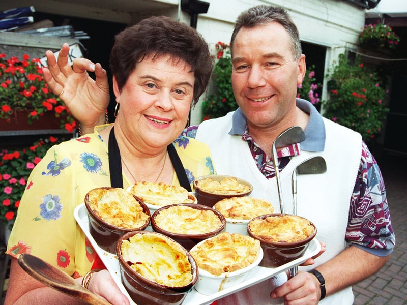 Rosina Friar shows off a tray of her famous rabbit pies and receives the seal of approval from her husband Merv Friar, at the Bay Horse pub, Hatfield, Doncaster, which the couple run, in 1997