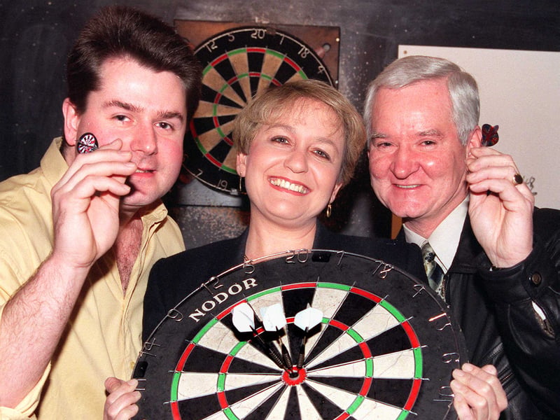 Doncaster Central MP Rosie Winterton kicks off a 12-hour fundraising darts marathon at the Horse and Groom pub, Armthorpe, in March 1999. She's pictured with Andy Hempsall and Councillor Tony Corden.