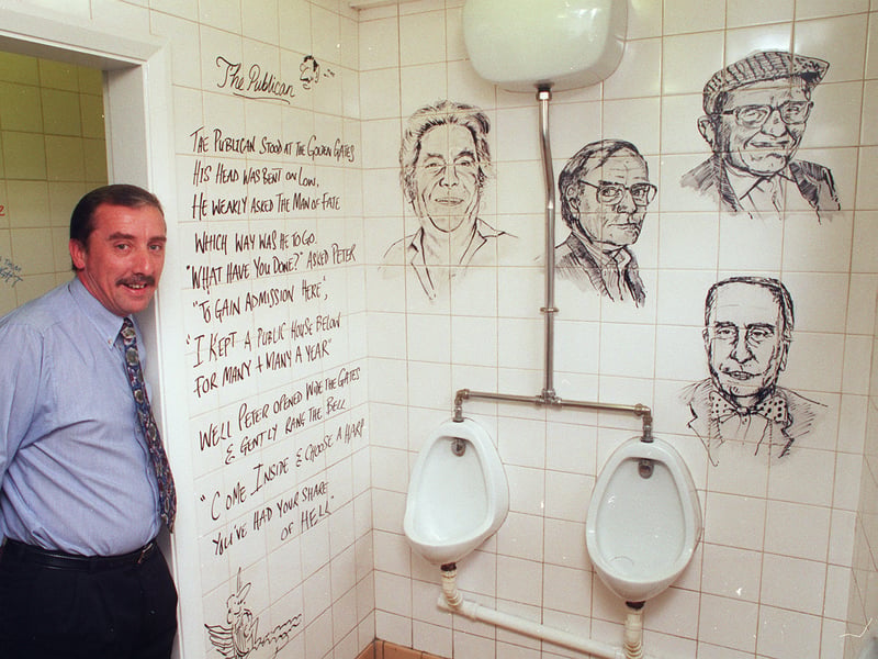 Manager Mike Kilner with the artwork in the gents' toilets at the Sportsman Inn, on Redmires Road, Lodgemoor, Sheffield, in 1999