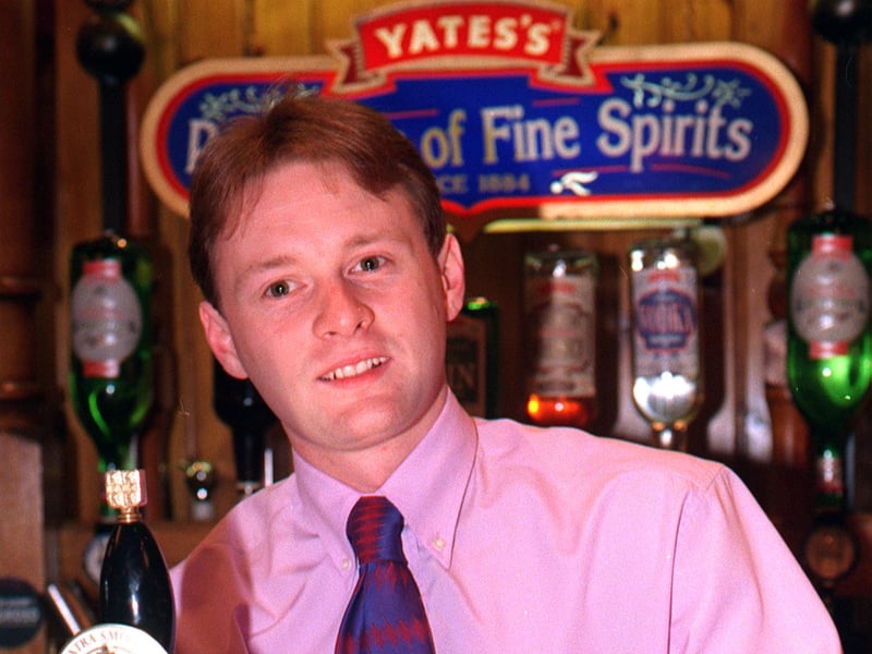 Assistant manager Simon Harrison pulling a pint at Yates Wine Lodge, Barnsley, in 1998