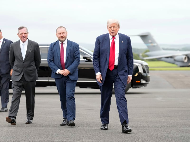 President Donald Trump walks to his car to head to Turnberry.