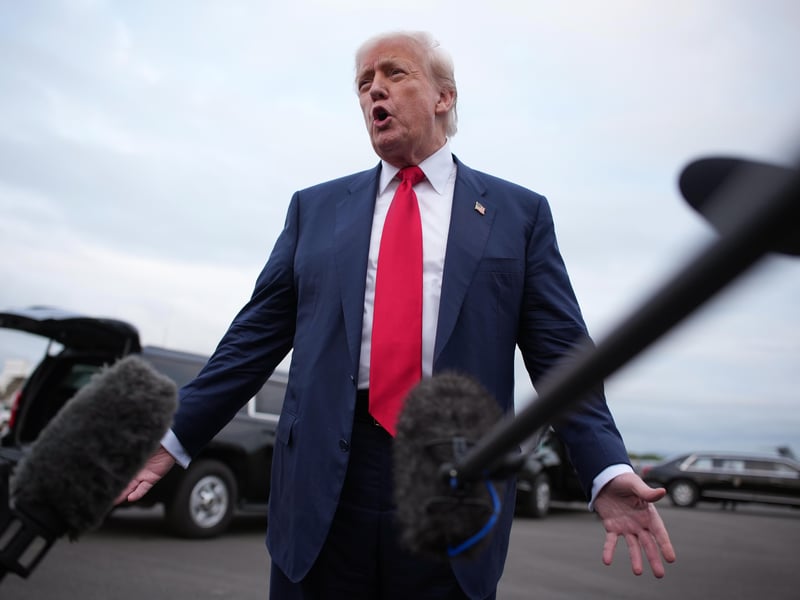  Donald Trump reacts as he speaks to the media