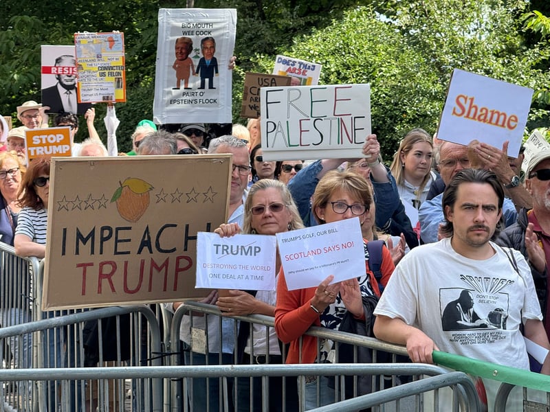 "Impeach Trump" and "Free Palestine"