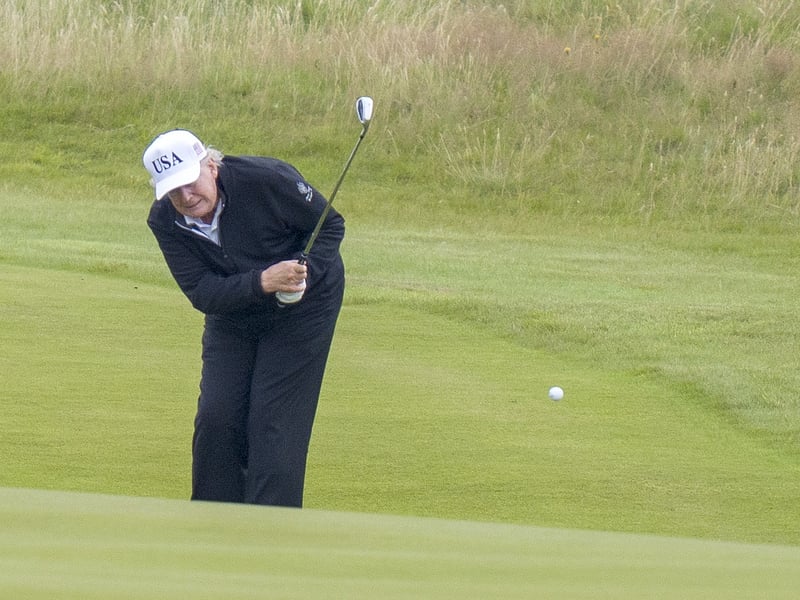 US President Donald Trump plays golf at his Trump Turnberry golf course in South Ayrshire