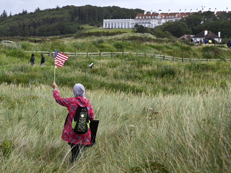 A supporter waves an American flag. 