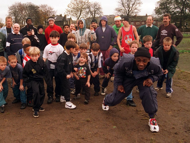 The boxer Herol 'Bomber' Graham joins children and adults getting ready for a sponsored run in aid of Children in Need, at Hillsborough Park in November 1996