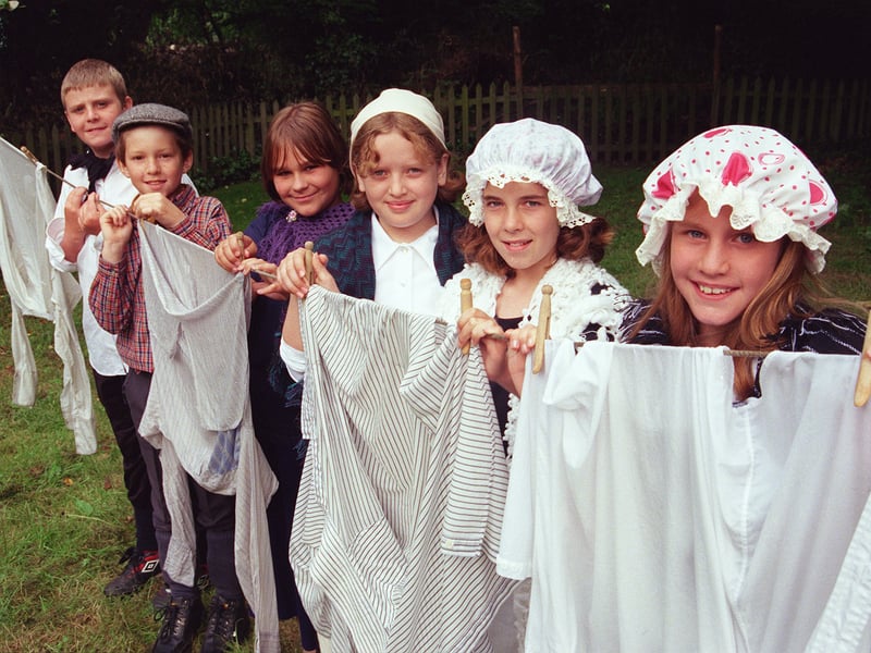 Children from Emmanuel Junior School, in Waterthorpe, Sheffield, are seen hanging out the washing during their visit to Abbeydale Industrial Hamlet in June 1999