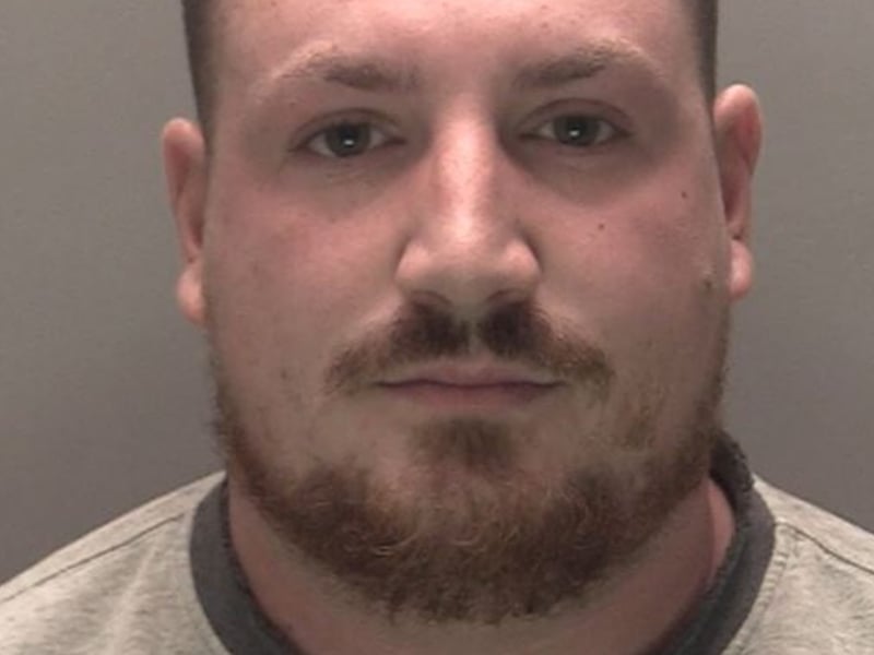 Sam Winstanley, 27 years, of Lune Road, Wigan, was sentenced to two years and eight months in jail for his role in violent disorder in Southport. The court heard that Winstanley travelled from Wigan to join in the disorder which took place on Sussex Road in Southport on July 30. He was seen on CCTV footage wearing a flag of the St George’s Cross to cover his face. He was at the forefront of the disorder and was captured on CCTV throwing multiple glass bottles at the police line.