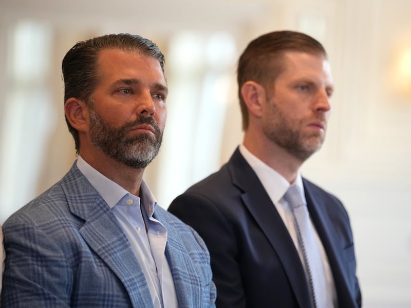 From left, Donald Trump Jr. and Eric Trump U.S. look on as President Donald Trump and President of the European Commission Ursula von der Leyen announce a US-EU trade deal. 