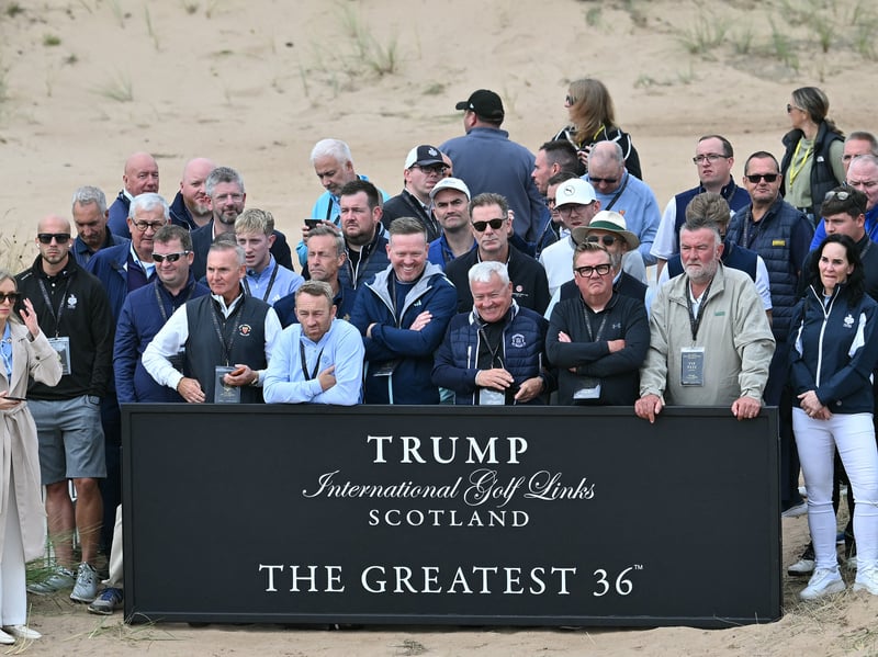 Guests wait behind a sign before US President Donald Trump arrived.