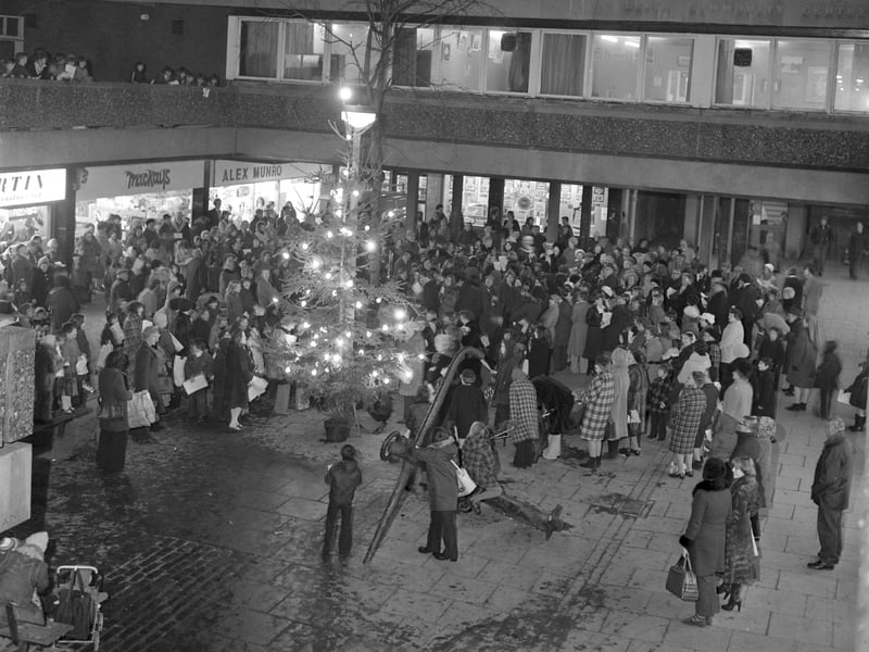Carol singers perform at the Kirkgate centre, Leith, in December 1976