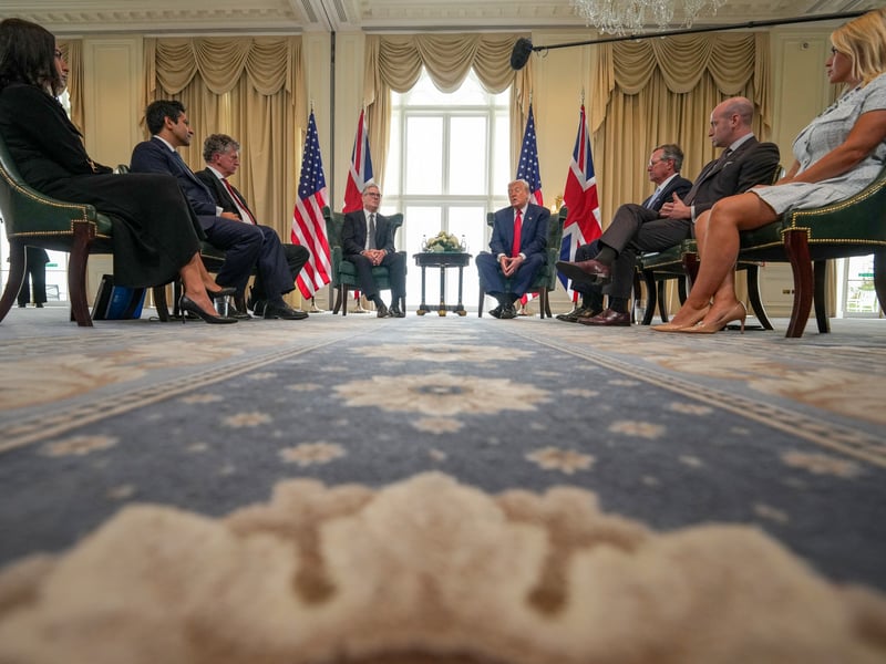 Britain's Prime Minister Keir Starmer (CL) speaks with US President Donald Trump (CR) during a bilateral meeting at the Trump Turnberry Golf Courses, in Turnberry south west Scotland on July 28, 2025. (Photo by Christopher Furlong / POOL / AFP) (Photo by CHRISTOPHER FURLONG/POOL/AFP via Getty Images)