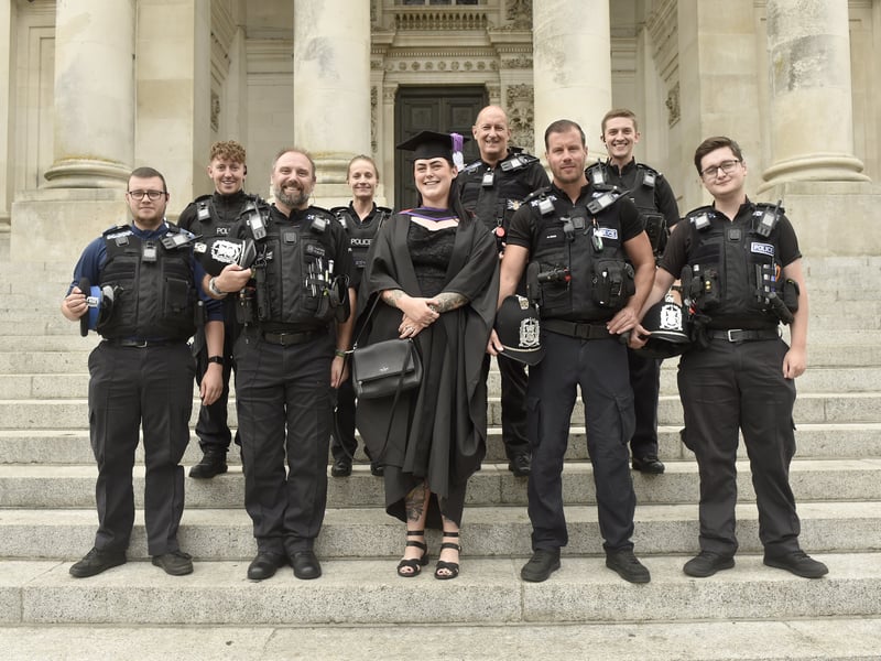 Pictured is: Lucy Ferguson with the policing unit she works with.
Picture: Sarah Standing (290725-7452)