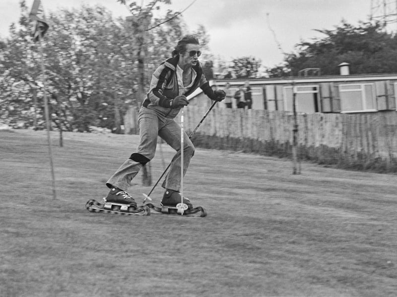 A skier tries out a grass slope in May 1974