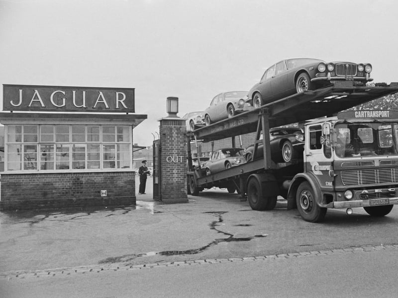 A car transporter leaves with its load of new cars after 10 weeks of strike action at the British Leyland Jaguar plant in Coventry in September 1972