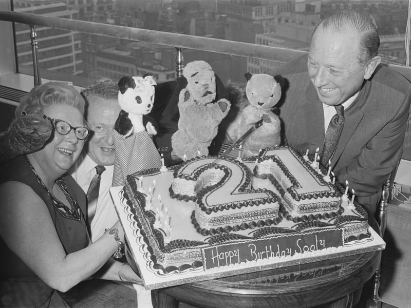 English puppeteer Harry Corbett, his wife Marjorie and friends Soo and Sweep celebrate Sooty's 21st birthday in April 1970