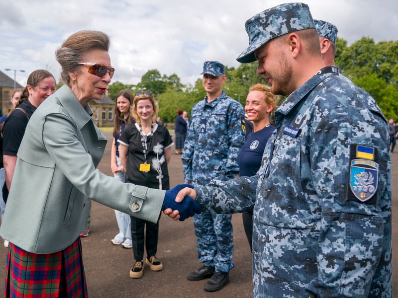 The Princess Royal meets members of the Ukrainian Navy Band during a rehearsal for this year's Royal Edinburgh Military Tattoo at Redford Barracks in Edinburgh.