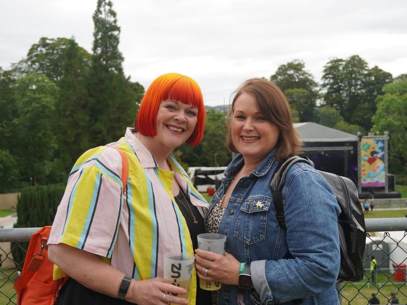 Friends enjoying a drink as they wait for their favourite acts.
